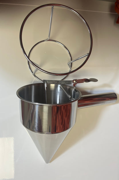 Entonnoir à piston inox avec support.